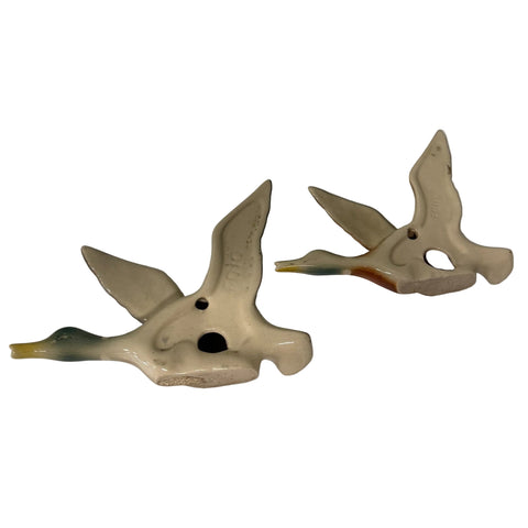Set of two vintage hand painted graduating wall ducks etched underneath with F010 and F011