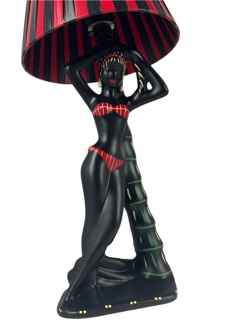 Barsony ceramic lamp, lady leaning on palm tree, with red and black shade. Height 75 cm.